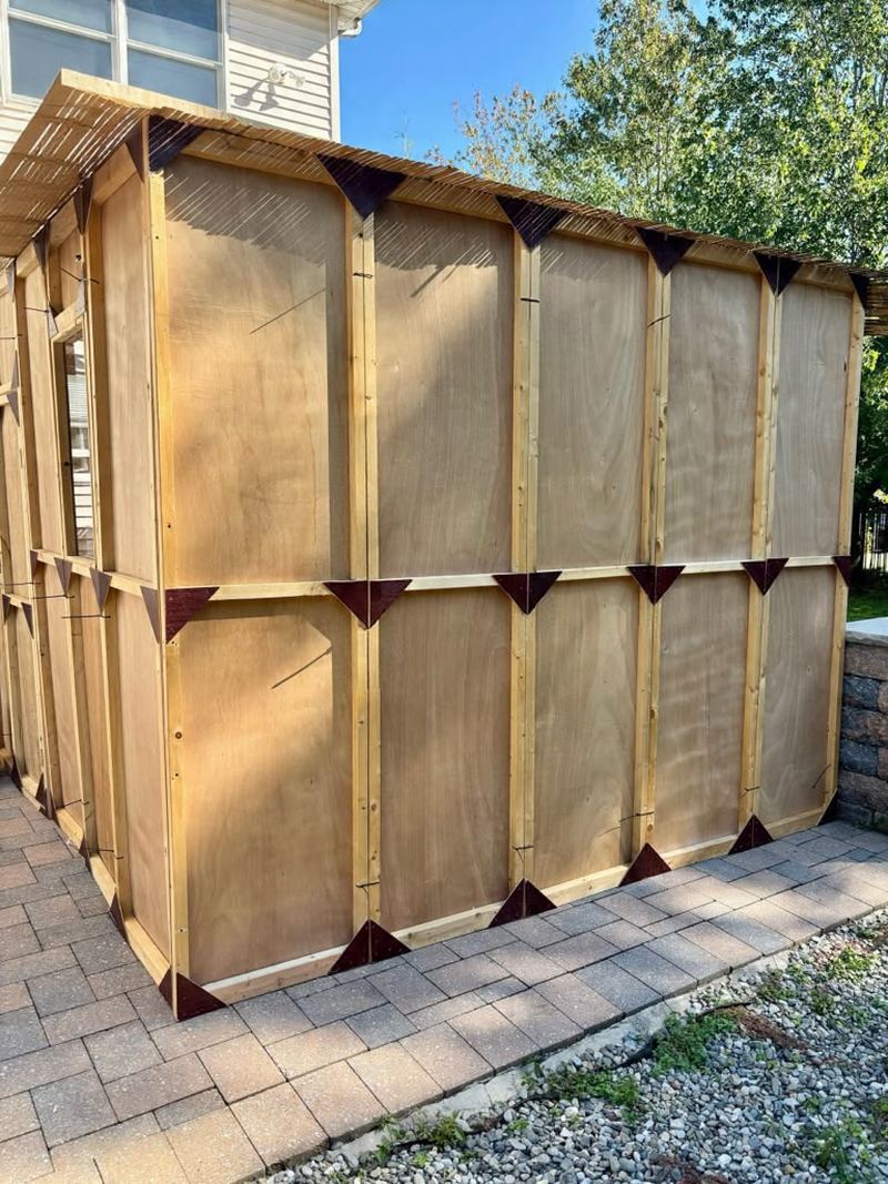 A finished classic wooden sukkah built by Premium Sukka Builders